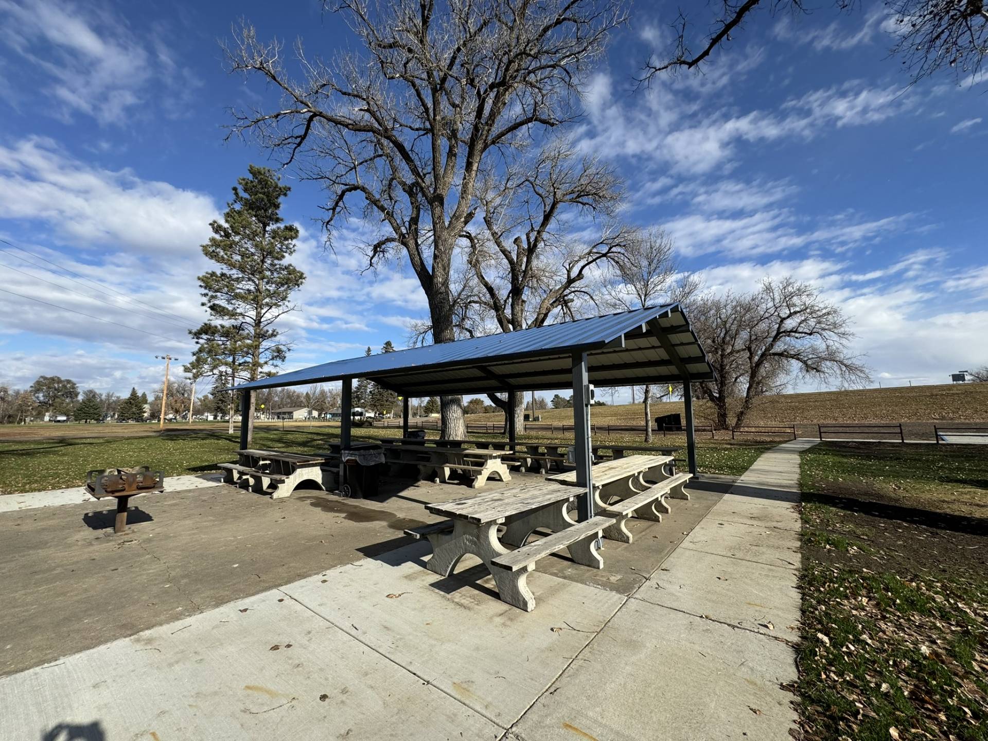 Picnic shelter with picnic tables near playground