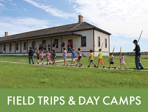 Kids at outdoor field trip learning about history of Fort Lincoln